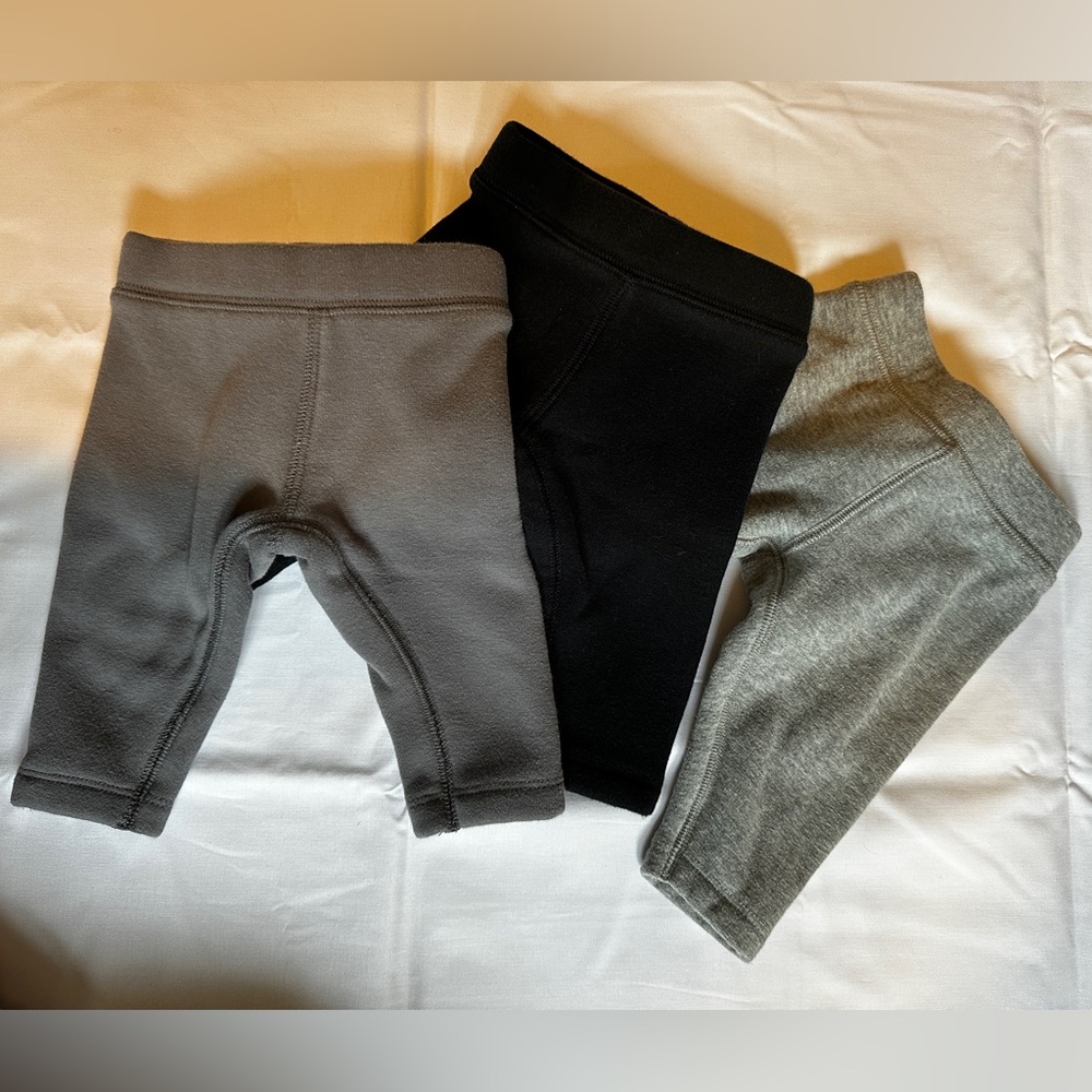 Three 0-3 primary cozy fleece pants
